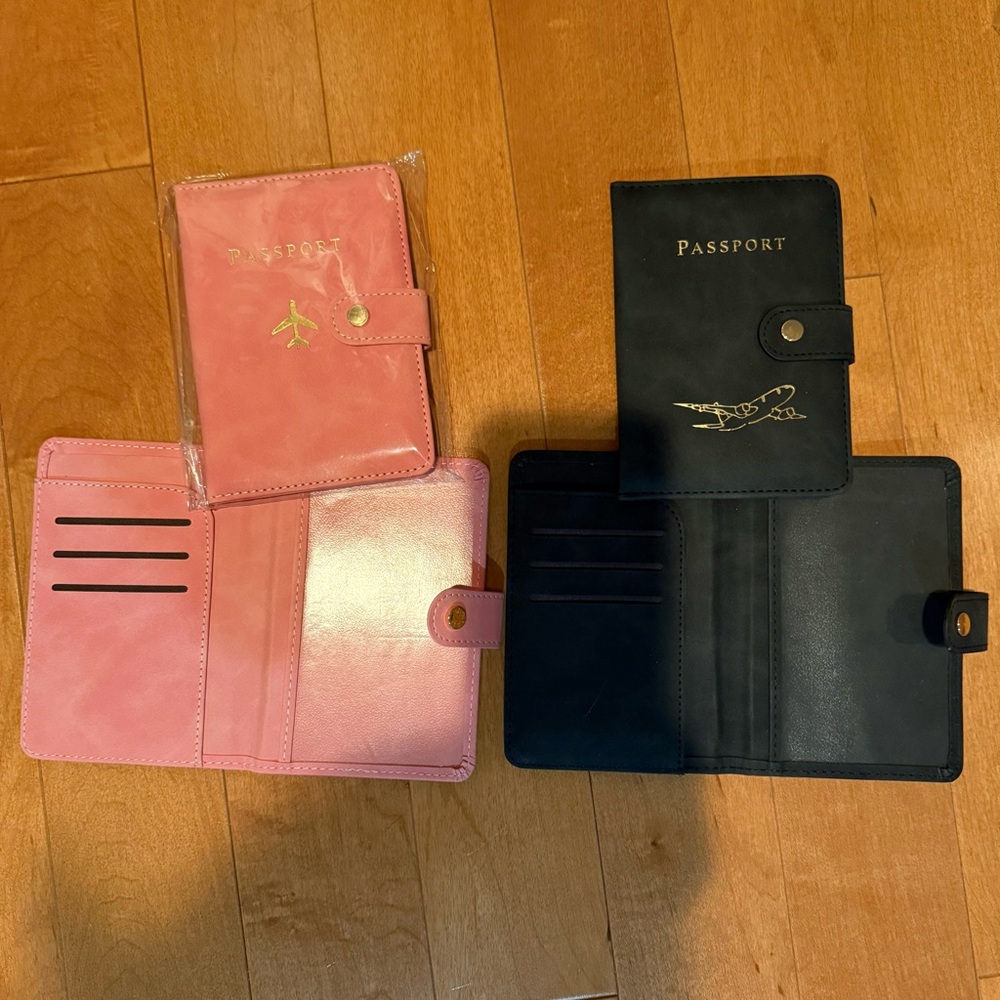 Pink and Black Passport Travel Holders. Selling all 4. New.